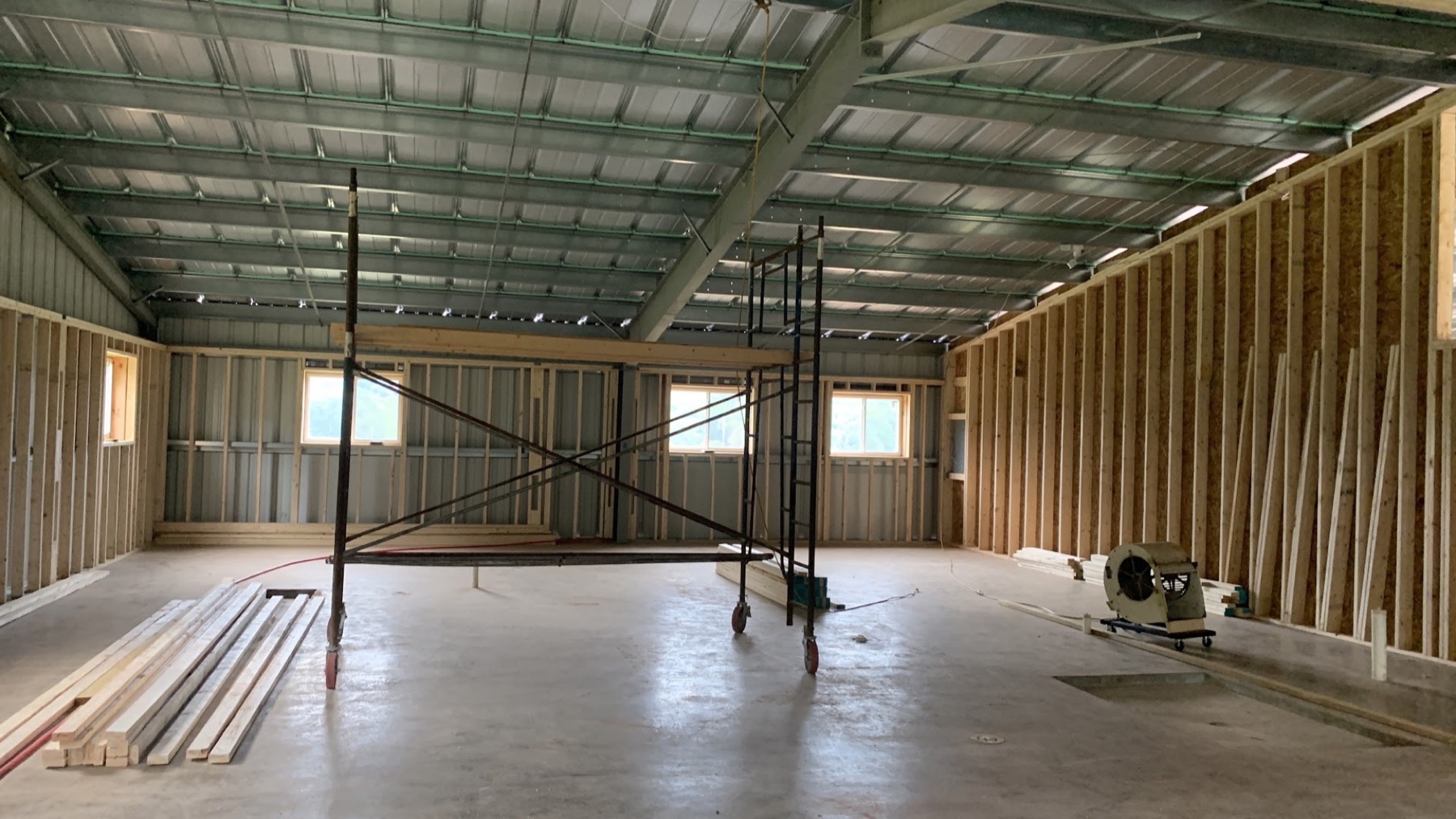 A shed interior with a smooth finished concrete floor