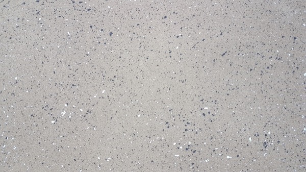 A close view of a washed exposed aggregate concrete surface