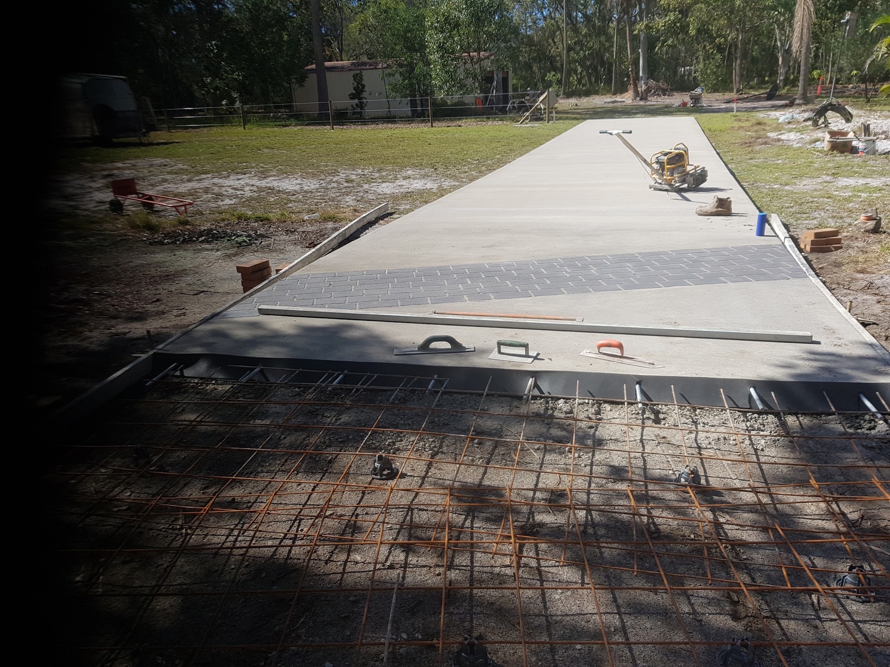 A formed slab with steel reinforcing mesh laid out ready for a pour